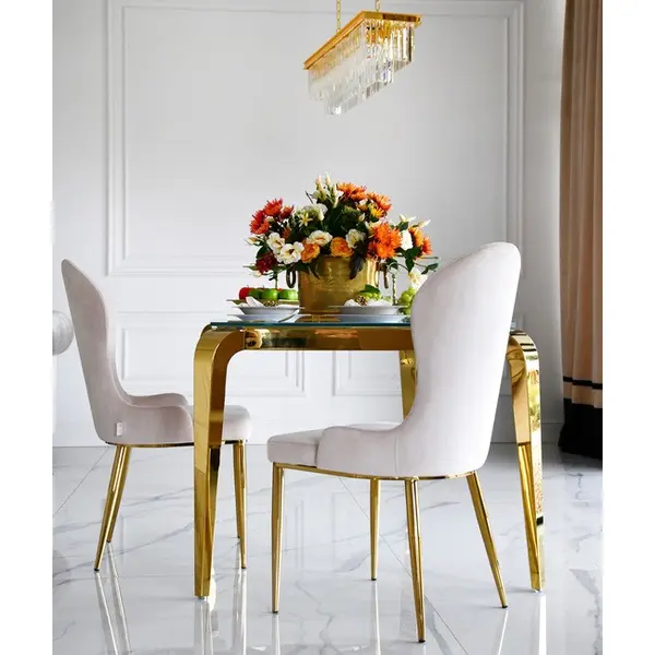 Designer dining table, glamor, with a glass top, steel, gold ELITE OUTLET