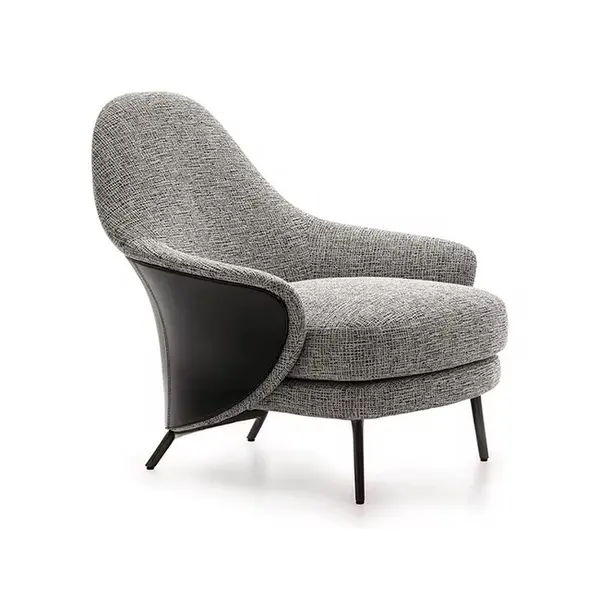 Modern, upholstered designer armchair on black legs with a LINEA footstool
