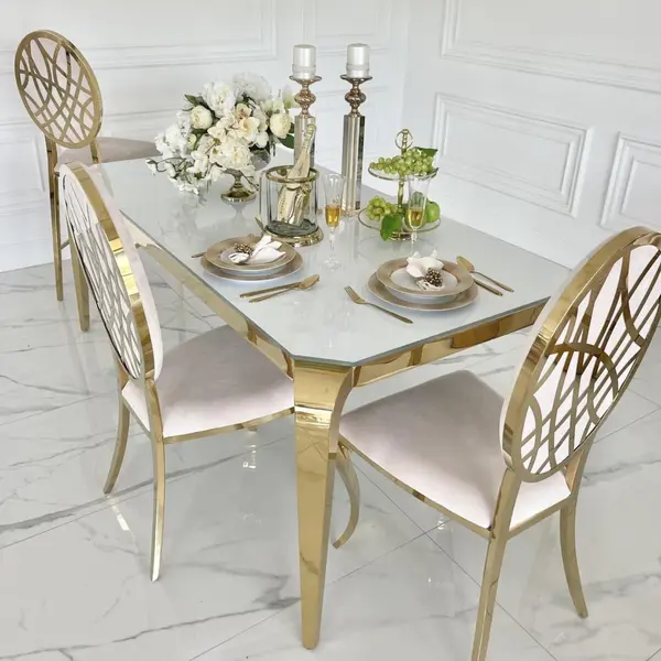 Designer dining table, glamor, with a glass top, steel, gold ELITE
