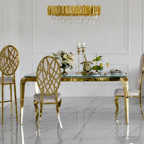 Designer dining table, glamor, with a glass top, steel, gold ELITE