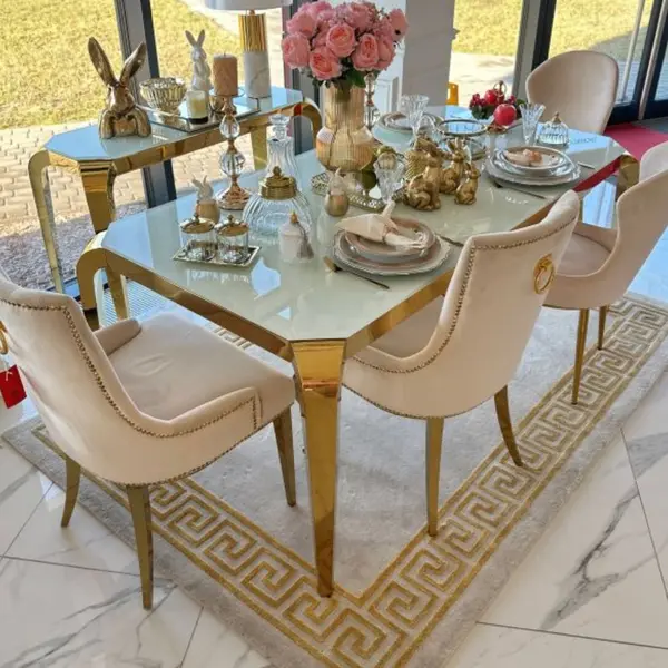 Designer dining table, glamor, with a glass top, steel, gold ELITE