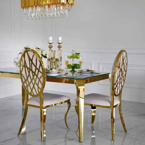 Designer dining table, glamor, with a glass top, steel, gold ELITE
