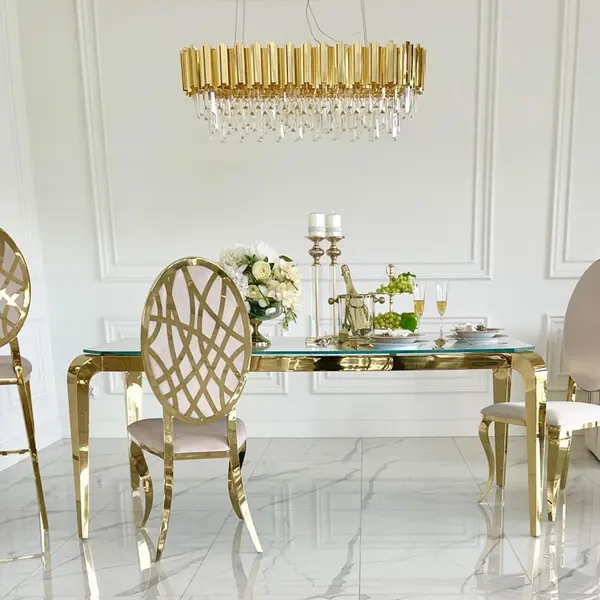 Designer dining table, glamor, with a glass top, steel, gold ELITE