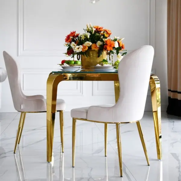 Designer dining table, glamor, with a glass top, steel, gold ELITE
