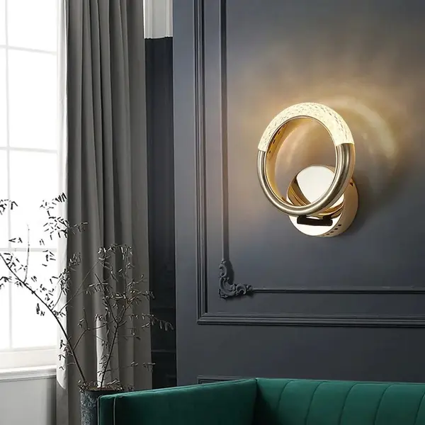 Złota lampa ścienna okrągła