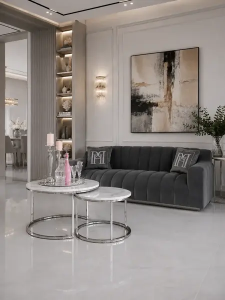 Widok z boku na okrągły stolik kawowy srebrny z marmurowym blatem 2w1, idealny do nowoczesnych wnętrz. Aranżacja nowoczesnego wnętrza od Primavera Home.