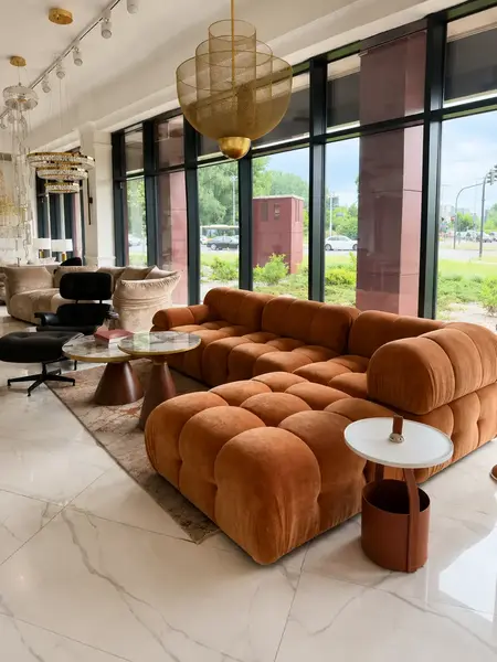 Zbliżenie na detal wykończenia designerskiego narożnika modułowego boucle NICEA od Primavera Home.
