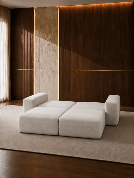 Luksusowa nowoczesna sofa rozkładana do salonu MODERNO z naciskiem na poduszki, podkreślające jej komfort. Detal wykończenia od Primavera Home.