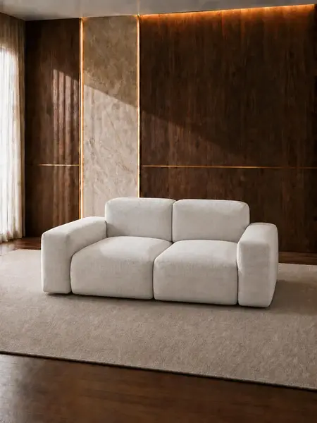Luksusowa nowoczesna sofa rozkładana do salonu MODERNO widziana z perspektywy podłogi, akcentująca jej wysokość. Aranżacja nowoczesnego wnętrza od Primavera Home.
