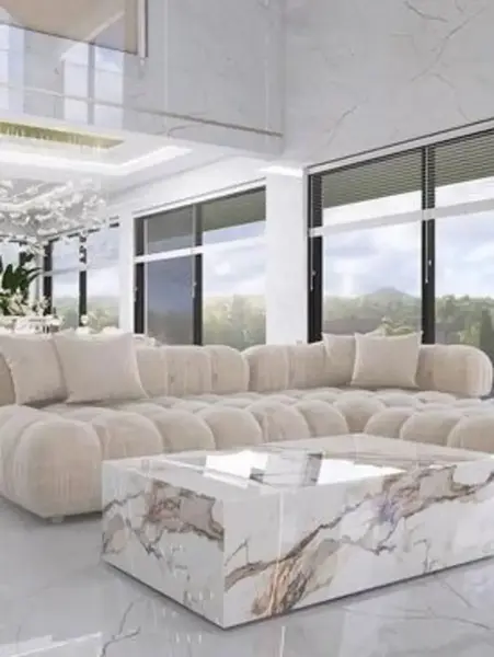 Perspektywa salonowa z designerskim narożnikiem modułowym boucle NICEA w eleganckiej aranżacji. Meble na zamówienie od Primavera Home.