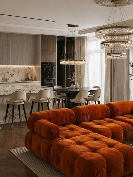 Perspektywa miejsca siedzącego z designerskim narożnikiem modułowym boucle NICEA w przestronnym salonie. Oferowane przez Primavera Home.