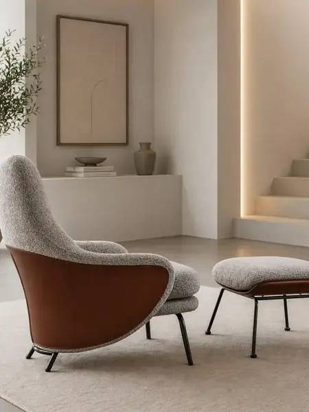 Designerski Fotel Linea z Podnóżkiem – Nowoczesny i Tapicerowany w ujęciu perspektywy. Ekspozycja w salonie od Primavera Home.