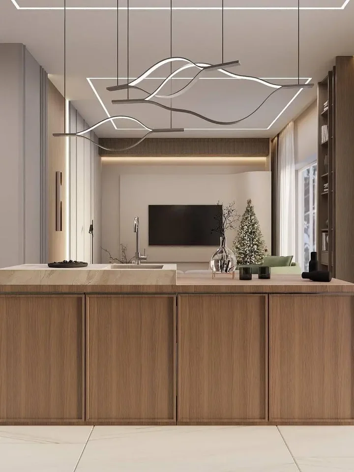 Złoty Żyrandol Nowoczesny Wave – Designerska Lampa Fala LED w otoczeniu ciepłych barw, stwarzająca przytulną atmosferę. Oświetlenie na zamówienie od Primavera Home.