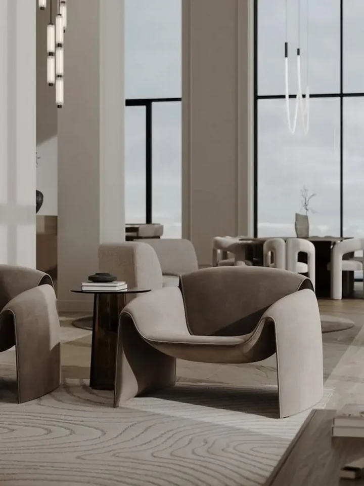 Fotel Noowczesny Spider w jasnym wnętrzu, dodający elegancji pomieszczeniu od Primavera Home.