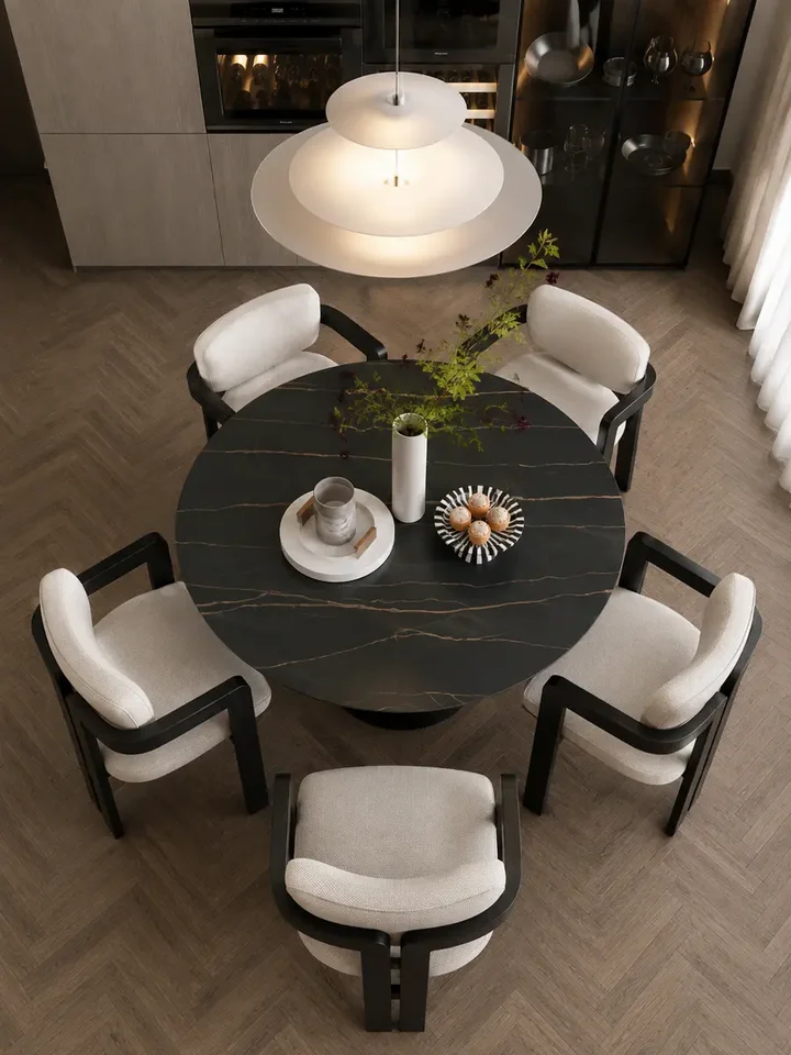 Okrągły Stół do Jadalni Oslo Spiekany kamień czarny Carrara i Stal Premium w perspektywie ukazującej elegancję. Ekspozycja w salonie od Primavera Home.