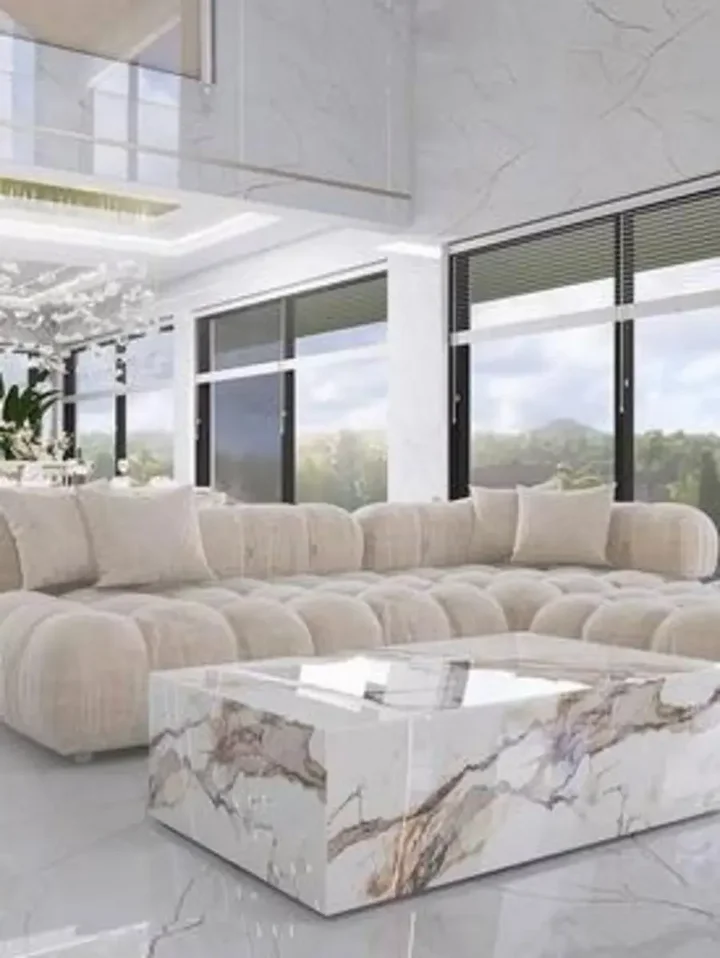 Perspektywa salonowa z designerskim narożnikiem modułowym boucle NICEA w eleganckiej aranżacji. Meble na zamówienie od Primavera Home.