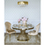 Designerski stół okrągły stalowy do jadalni z białym, czarnym blatem marmurowym nowoczesny glamour złoty ANTONIO 