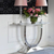 Glamor console in a modern style with a white marble top, silver ART DECO