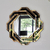 Spiegel in einem goldschwarzen geometrischen Rahmen DUNE GOLD BLACK 85x85 