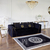 Black velvet quilted sofa, modern in a glamor style, for a golden living room MONTE CARLO