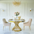 Designerski stół ANTONIO 130 cm okrągły stalowy do jadalni z białym, czarnym blatem marmurowym nowoczesny glamour złoty 
