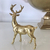 Christmas decoration golden reindeer, table decoration, shine 